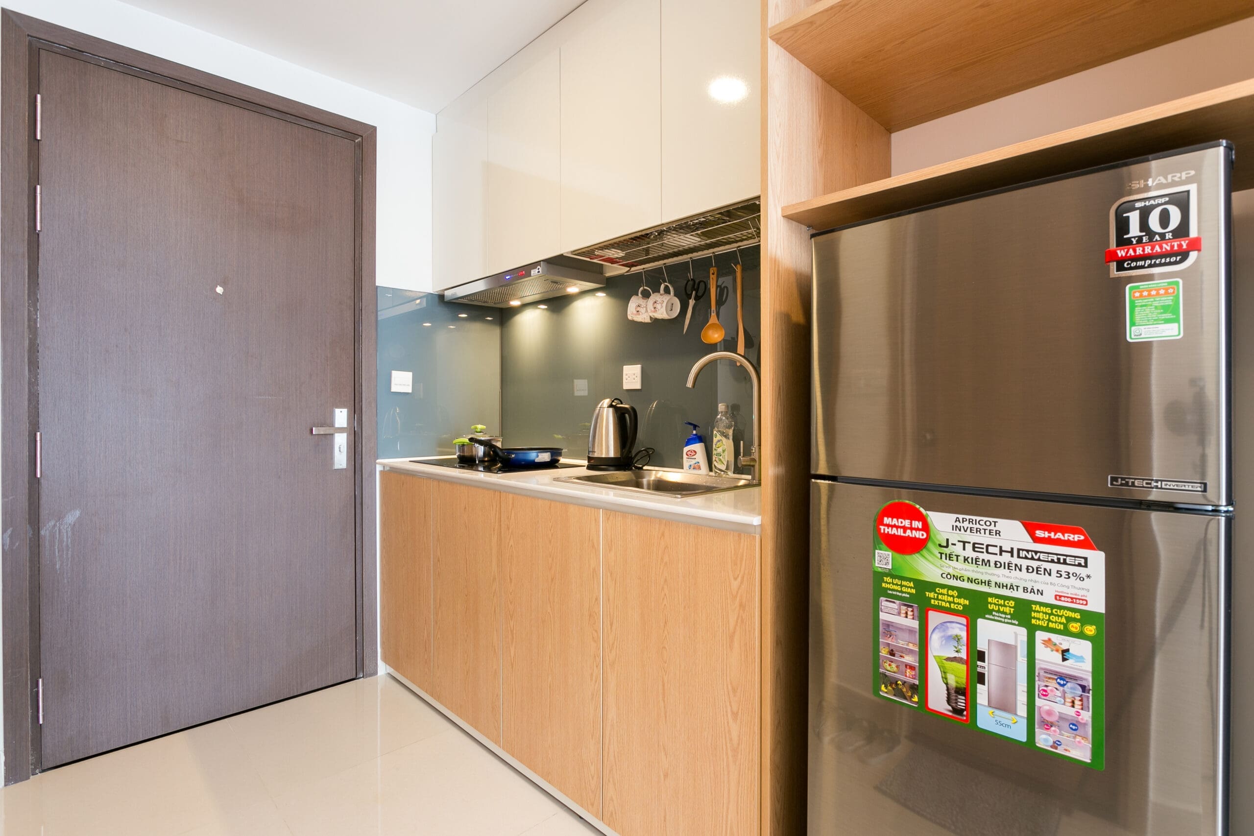Kitchenette and Entrance View of Studio Apartment at RiverGate Residence