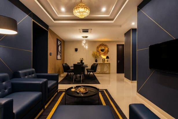 Phòng khách căn hộ 3 phòng ngủ tại RiverGate Residence, thiết kế sang trọng với sofa da, bàn ăn và đèn chùm hiện đại – lựa chọn hoàn hảo cho gia đình Việt kiều 4–6 người khi về nước nghỉ dưỡng dài ngày.